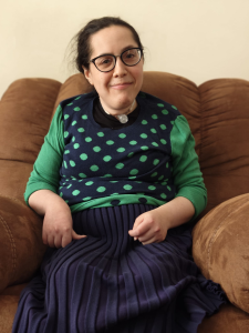 Esther sitting on a couch